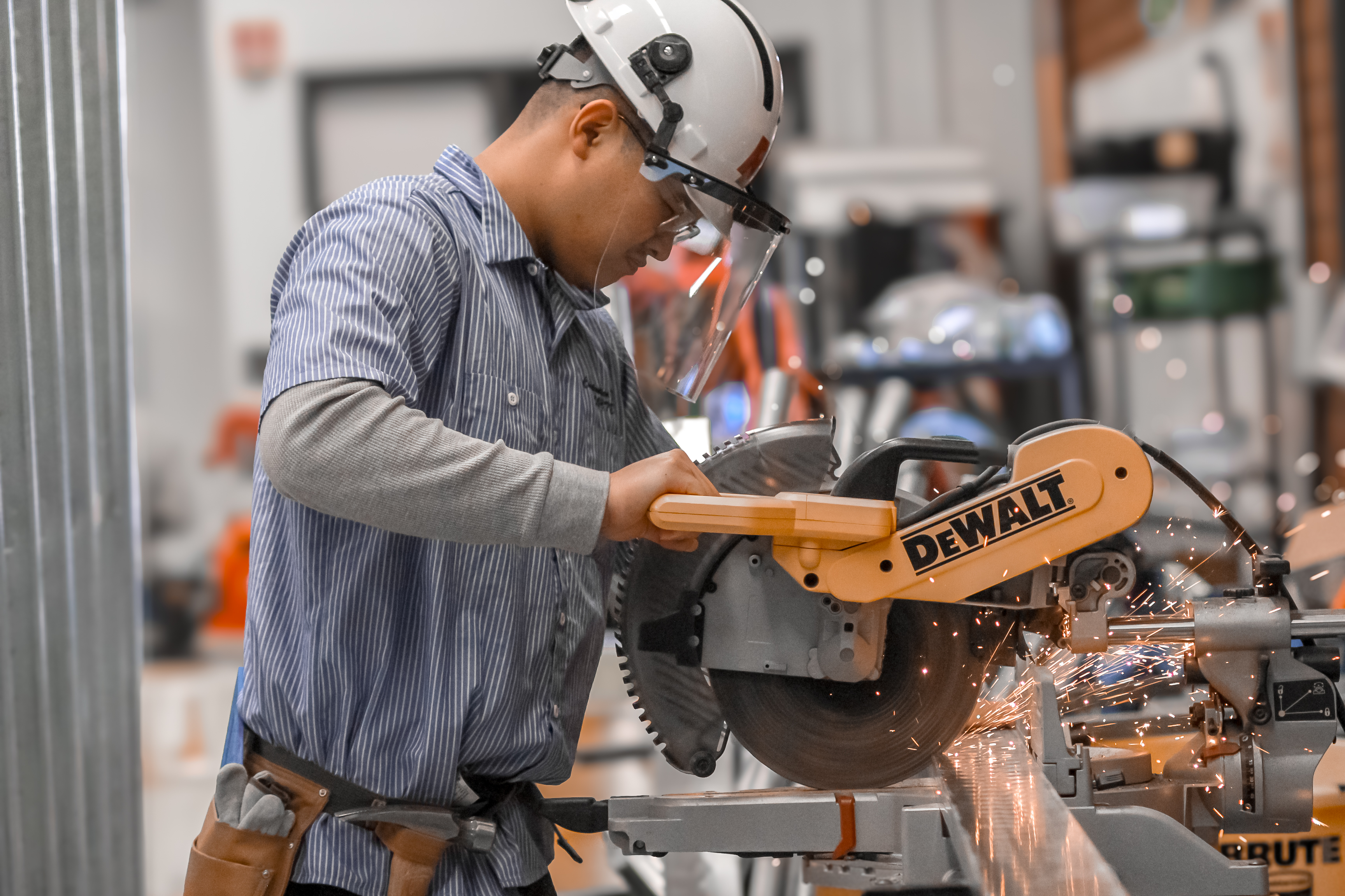 Construction student using equipment